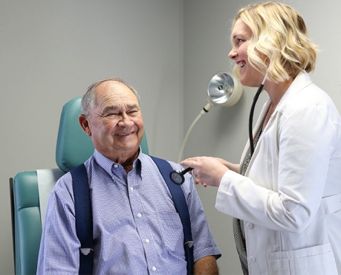 Doctor at Taylor Regional Hospital aids patient.